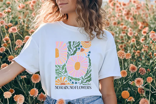 a woman standing in a field of flowers