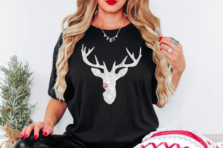 a woman wearing a black shirt with a deer head on it