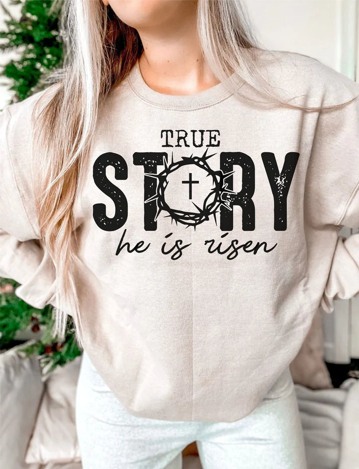 a woman wearing a sweatshirt that says true story he is risen