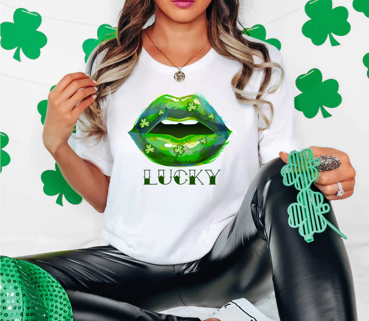 a woman wearing a lucky shirt with a green kiss on her lips