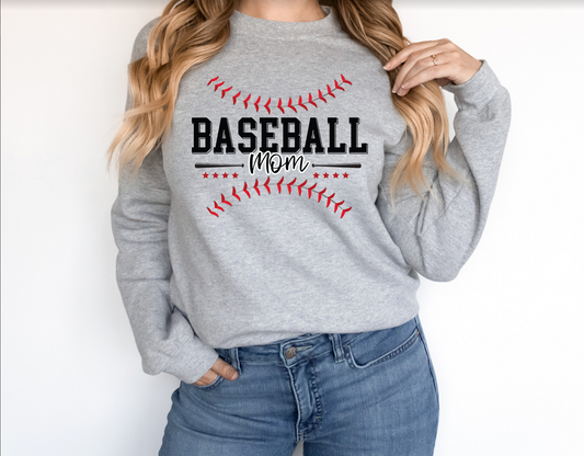 a woman wearing a baseball mom sweatshirt