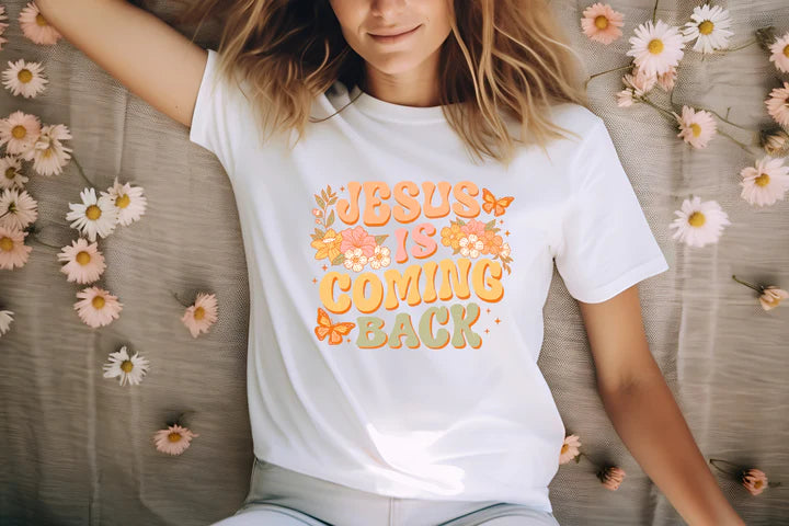 a woman wearing a jesus is coming back t - shirt