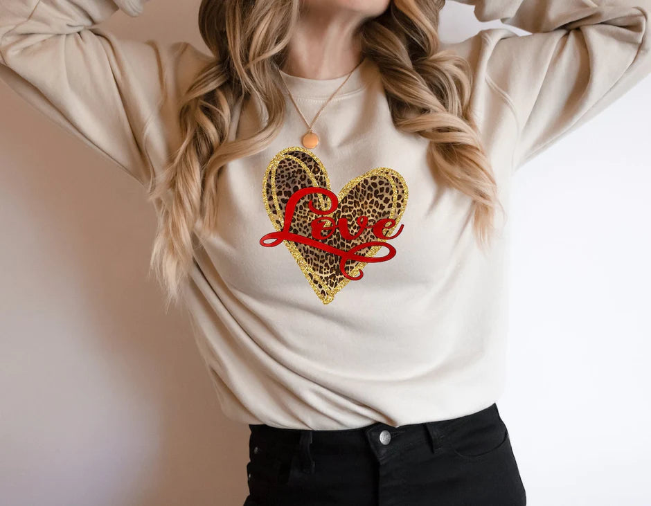 a woman wearing a sweater with a heart on it