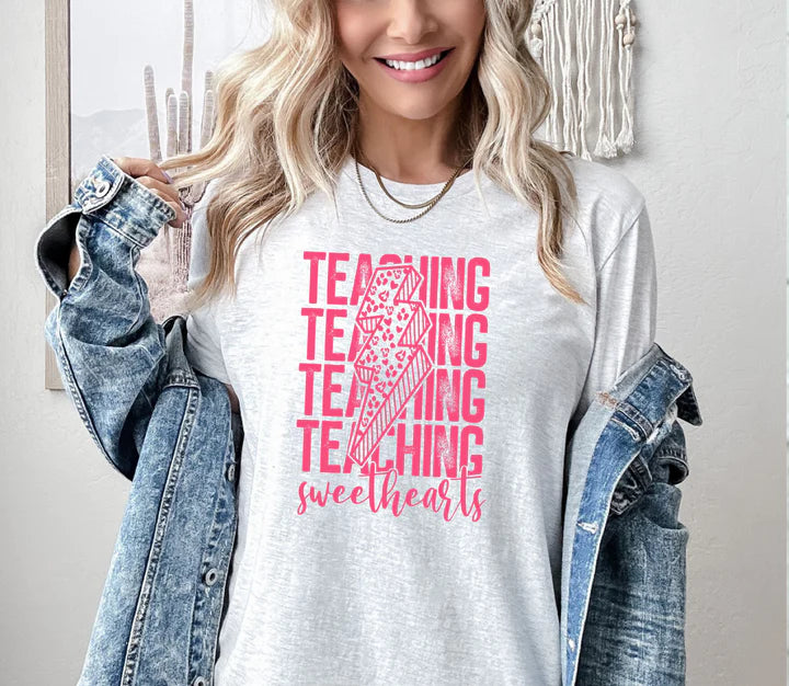 a woman wearing a t - shirt that says teaching is awesome
