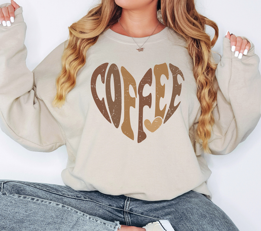 a woman wearing a sweatshirt with the word coffee printed on it