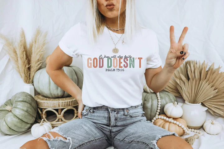 a woman sitting on a bed with a peace sign