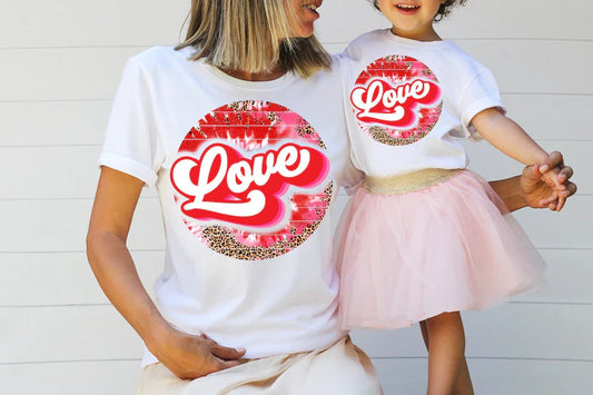 a mother and daughter wearing love t - shirts