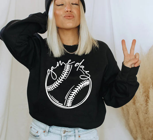 a woman wearing a black baseball sweater and a beanie